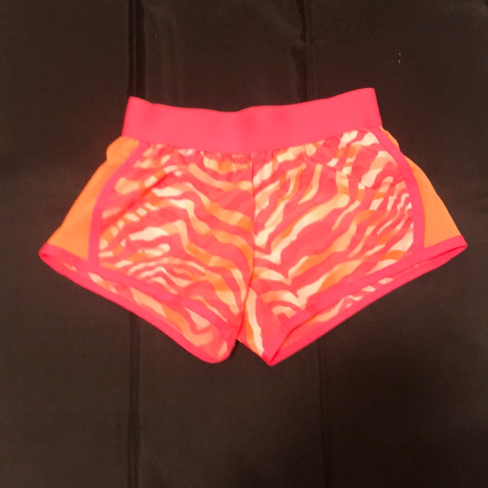 Like new Justice pink, orange, and white shorts